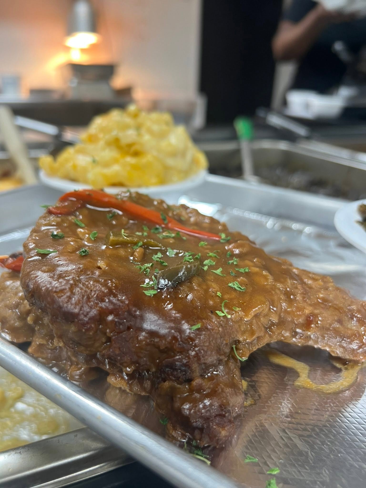 Smothered pork chop covered in gravy